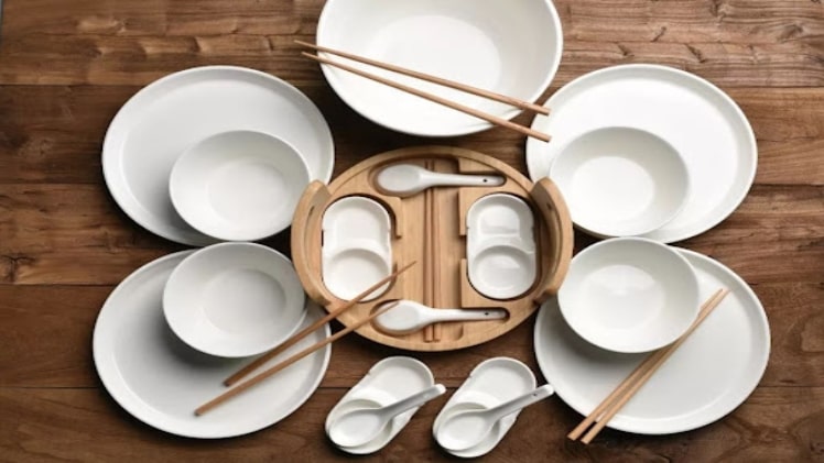 a layout of white Chinese restaurant dinnerware with accessories